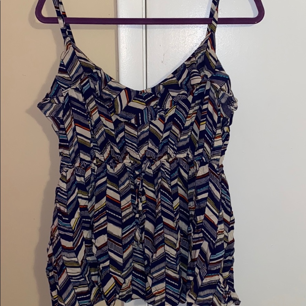 Baby doll sleeveless blouse.